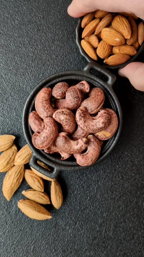 Cashew nuts in shell in bowl Stock Footage 304490585