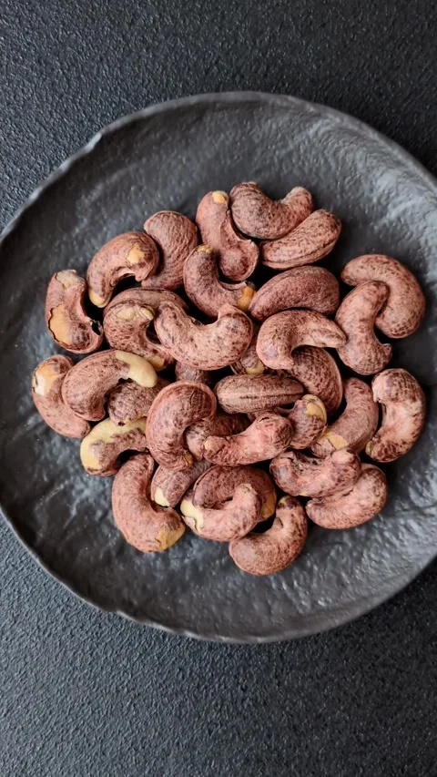 Cashew nuts in shell in bowl Stock Footage 304490595