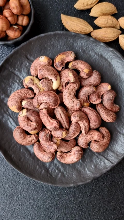 Cashew nuts in shell in bowl Stock Footage 304490599