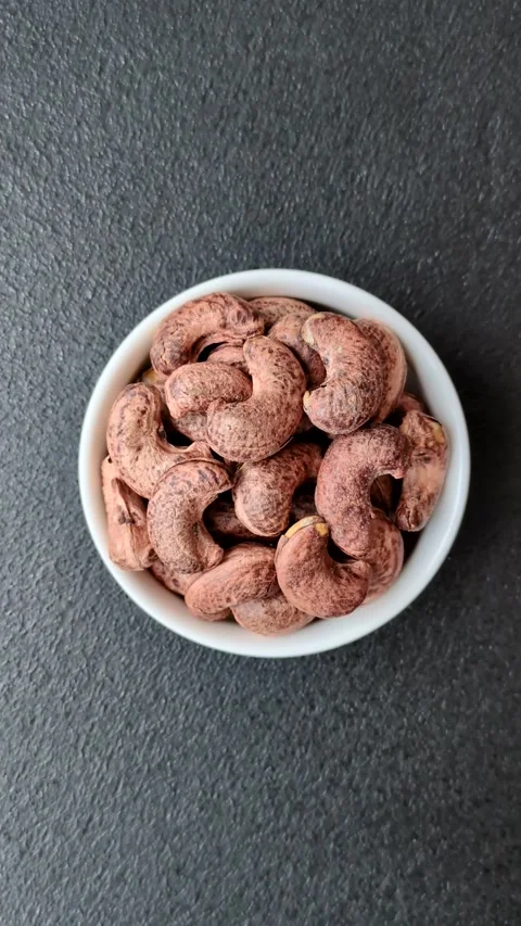 Cashew nuts in shell in bowl Stock Footage 304490604