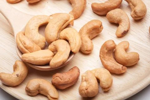 Cashew nuts in spoon Stock Photos