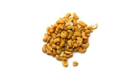 Cashew nuts on a white background. Macro photo. Stock Photos