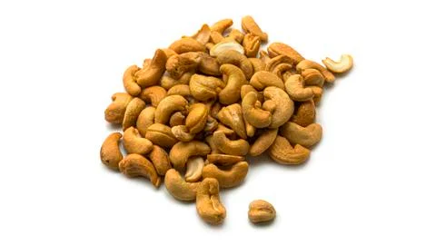 Cashew nuts on a white background. Macro photo. Stock Photos