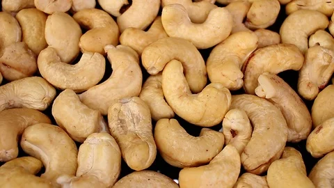 Cashew seed nut looping texture pattern closeup video Stock Footage 99012921