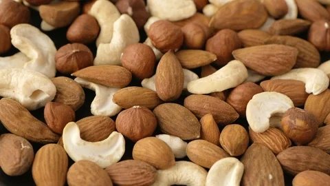 Cashews, almonds and hazelnuts rotating Video stock 115366720