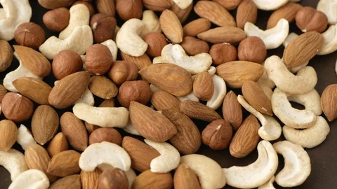 Cashews, almonds and hazelnuts rotating Video stock 115367586