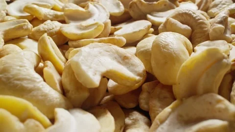 Cashews heap with falling kernels. Organic snack. Pile of cashews without shell 스톡 동영상 293159504