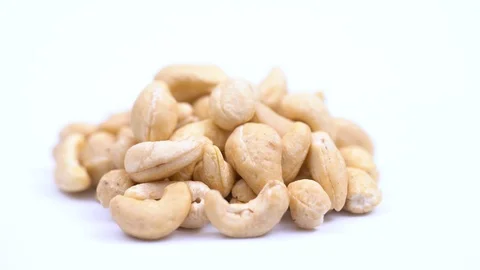 Cashews spin on its axis on a white background. Video stock 113702584