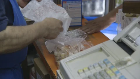 Cashier checking out customer Stock Footage 104881869