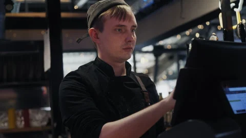 Cashier Using Touch Screen Register Stockbeeldmateriaal 307087695