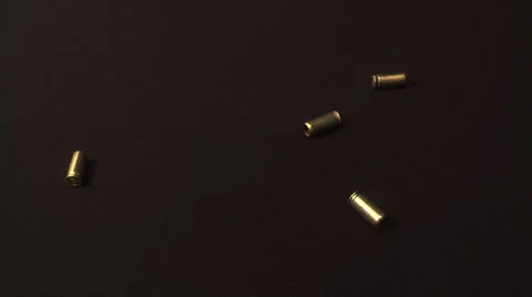 Casings from the gun fall Stock Footage 39311927