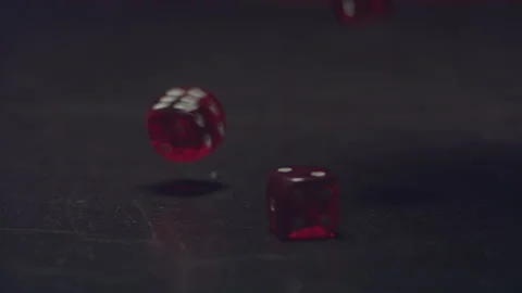 Casino-01-04-Close-up-view-of-red-dice-falling-on-black-table-gambling Stock Footage 132964688