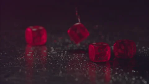Casino-01-10-Macro-view-of-red-dice-falling-on-black-table-playing-game Stock Footage 132967374