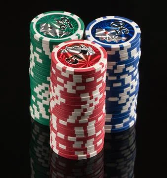 Casino chips on a black background with reflection. The concept of gambling.. Stock Photos