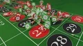 Casino chips fall on roulette table gambling drop win money 4k or 4k+ Resolution