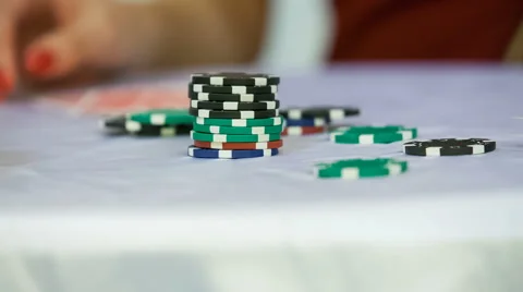 Casino chips on white table Stock Footage 66362925