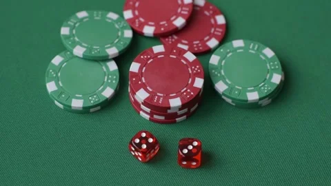 Casino dice and chips on a colored background, poker, gambling with bets. Dice a Vidéo 328872715