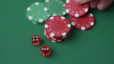 Casino dice and chips on a colored background, poker, gambling with bets. Dice a Stock Footage 328872717