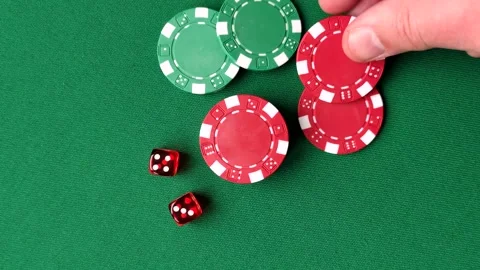 Casino dice and chips on a colored background, poker, gambling with bets. Dice a Stock Footage 328872974