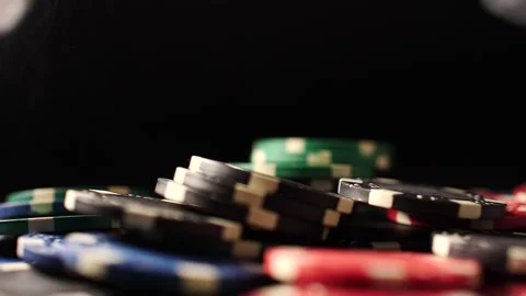 Casino poker chips stack of black ships being tossed in slow motion Video stock 205535709