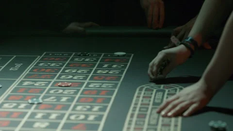 Casino roulette table bets and collecting chips Stock Footage 237459174