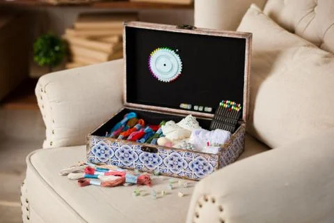 Casket for needlework, sewing in style interior Stock Photos