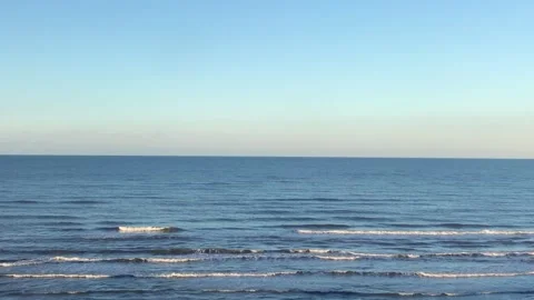 Caspian Sea with subtle waves rolling towards the shore Stock Footage 336246918