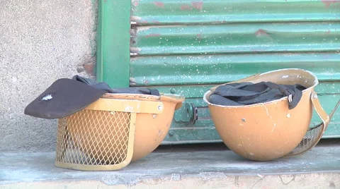 Casques lying on the ground at Srinagar in Jammu and Kashmir, India Stock Footage 46932759