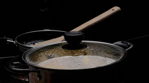 Cassava boiling in a pot with sugar to making Thai dessert or Singkong Rebus. Stock-Footage 158661993