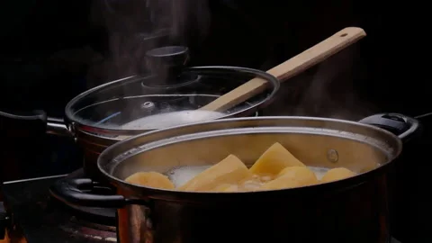 Cassava boiling in a pot with sugar to making Thai dessert or Singkong Rebus. 動画素材 158662172