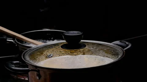 Cassava boiling in a pot with sugar to making Thai dessert or Singkong Rebus. Stock Footage 158662178