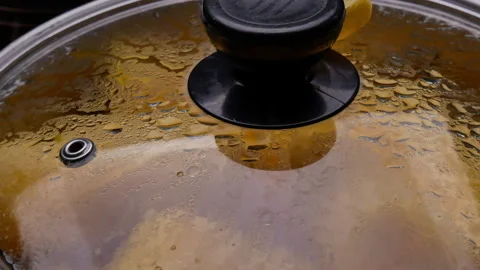 Cassava boiling in a pot with sugar to making Thai dessert or Singkong Rebus. Видео 158662428