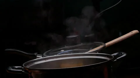 Cassava boiling in a pot with sugar to making Thai dessert or Singkong Rebus. Stock Footage 158663222