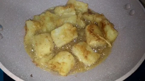Cassava pieces fried in a pan with boiling oil. Stock Footage 305770126
