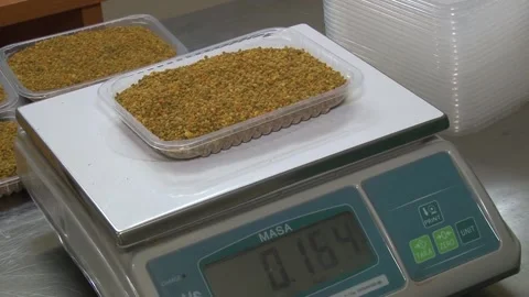 The casserole with bee pollen is weighed Stock Footage 141976513