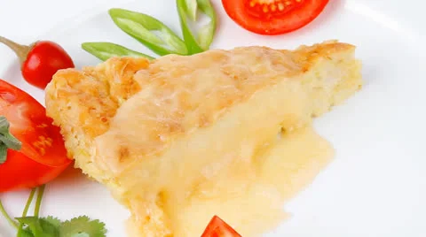 Casserole triangle on white plate Stock Footage 22845051
