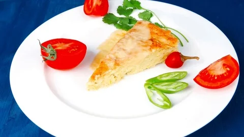 Casserole triangle on white plate Vídeos de archivo 82079345