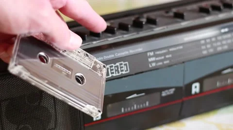 Cassette inserting into an old tape recorder 動画素材 62020866