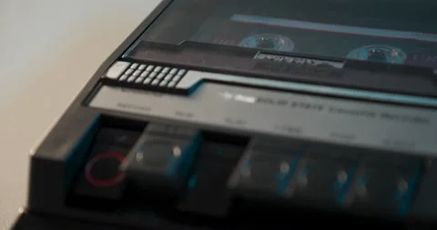 Cassette Recorder Being Engaged With Rack Focus To Reels Stock Footage 233369802