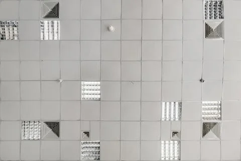 Cassette stretched or suspended ceiling with square halogen spots lamps and d Stock Photos