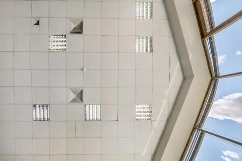 Cassette stretched or suspended ceiling with square halogen spots lamps and d Stock Photos