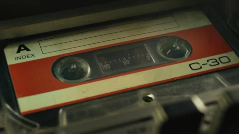 Cassette tape playing in a deck. Close-up perspective shot Stock Footage 339624595