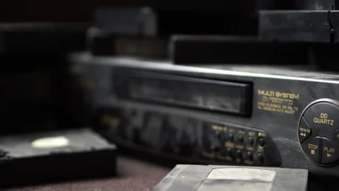 Cassette VHS ejected in video cassette recorder. Video stock 234407372