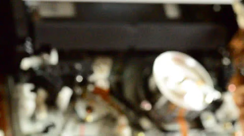Cassette videotape recorder inside. Rack focus and dolly in/out. Stock Footage 24654715