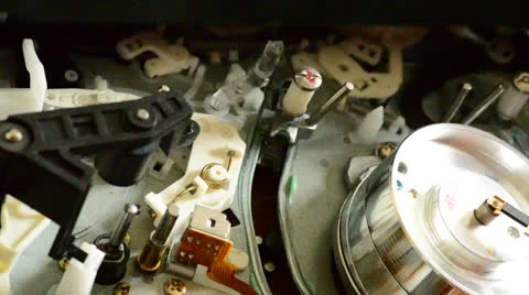 Cassette videotape recorder inside. Rack focus and dolly in/out. Vídeos de archivo 24654716