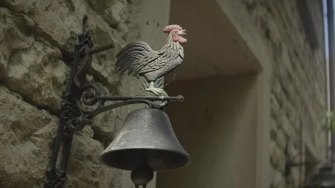 Cast Iron Bell With Rooster Figure, Old Stone Masonry Wall, Close Up Shot Stock-Footage 341424778