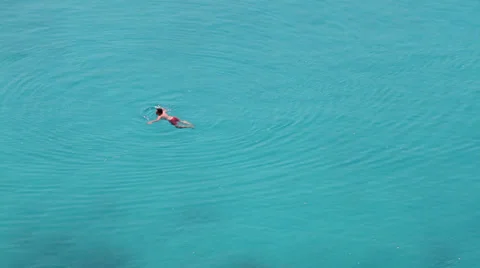 Castaway in deep blue seawaters Stock Footage 25169598