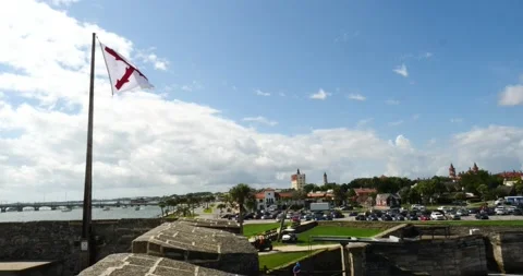 The Castillo de San Marcos masonry fort Cross of Burgundy flag flying in the win Video stock 210299491