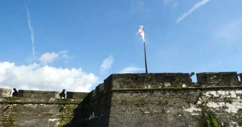The Castillo de San Marcos oldest masonry fort St Augustine tilt up to flag wind Stock Footage 210298125