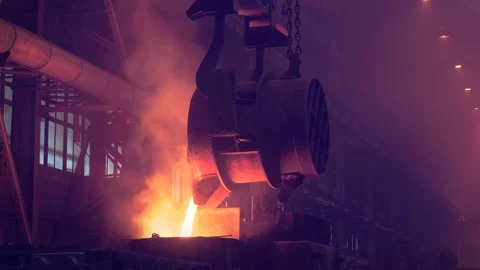 Casting into mold from container of liquid iron or metal. Blast Furnace Steel Stock Footage 153141682